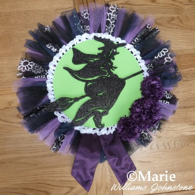 Witchy wreath design with netting and fabric pom poms