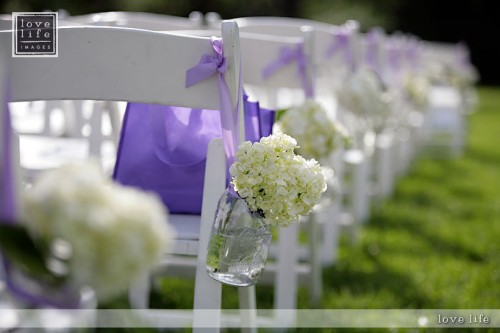 Hydrangeas frame this wedding aisle beautifully for an outdoor wedding