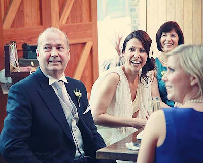 bride laughing at speeches at St Chads place wedding