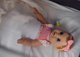 Luvabella Doll in crib