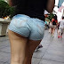 Latin showing her ass cheeks in jeans shorts