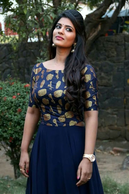 Aishwarya Rajesh looking resplendent in a blue traditional outfit, exuding elegance and grace.
