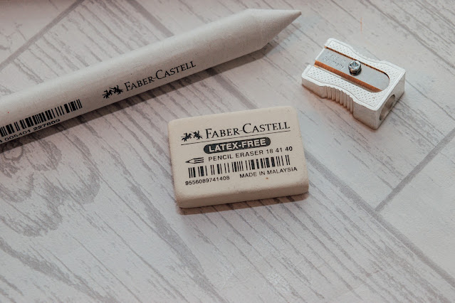 A blending pencil, eraser and sharpener