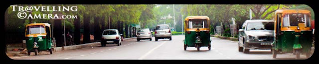 Dilli Bhraman in Monsoons  to check out the state of the city before CWG 2010 (Common Wealth Games) : Posted by VJ SHARMA @ www.travellingcamera.com : On a weekend, we were discussing overall progress of Delhi in last few months for Common Wealth Games.. and there were many debates happening on dinner table.. After some time we decided to have a round of Delhi next day to see what all is happening... Here are few photographs with some brief details about this journey which started from Noida...Yellow-&-Green Auto-Rikshaws are identity of Delhi and first attempt was to find an auto at reasonable cost for a day, which is very difficult task in Noida.. We hired one till Mayur Vihar Phase-1 to catch another friend there... After leaving Noida, we saw a fly-over where construction was going on and most of us thought that its impossible to complete it before CWG.. Lets see what happens...One of the Stadium near Safdarjung Tomb in Delhi...Its probably Jawaharlal Nehru Stadium... Just found another photograph of this stadium with nice details @ http://www.prlog.org/10899688-jawaharlal-nehru-stadium-features-tensile-membrane-fabric-roof-from-birdair-inc.html Green Delhi... I love all the drives around India Gate and CP.. These areas are comparatively green and clean... As you must have noticed that suddenly the main idea disappeared after some time.. I mean, after lunch no one was interested in exploring CWG progress... Here is a photograph of DND which connects Delhi with Noida... Its not allowed to stop the car on DND, so its clicked from moving car having tinted glasses :-) Another photograph of Wide roads of Delhi with sufficient greenery around...Some decorative stuff planted in the center of INA flyovers... Check out http://en.wikipedia.org/wiki/2010_Commonwealth_Games for more details about CWG 2010