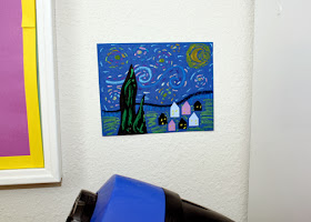 Inspiration struck as Tessa worked on her original "Starry Night," so I snatched a scrap from the trashcan and went to work. I hung my mini masterpiece, which is only a couple of inches tall, next to the school table. It makes me happy when I look at it for some reason.