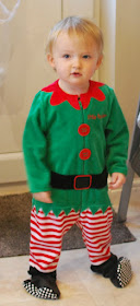 Our-First-Blogging-Christmas-picture-of-toddler-in-Elf-suit-that's-too-big