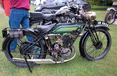 Vintage Royal Enfield motorcycle on display at event.