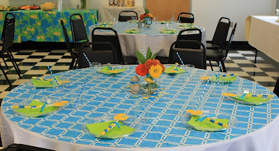 The tables were decorated in tones of turquoise, bright yellow and ...