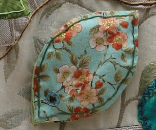 Leaf 4 - a bluey material with a wild rose open flowers pattern