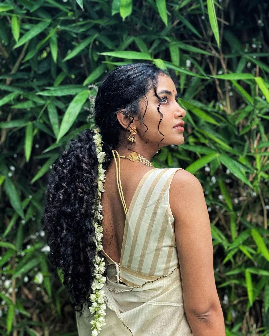 Anupama Parameswaran graceful looking in white Saree