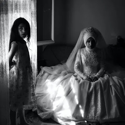 An image of a very alone two girl in white and black dress.