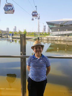 Dan Jon posing near the Emirates Air-Line at the Thames