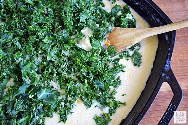 Mac and Cheese with Kale and Bacon mixing in fresh kale | by Life Tastes Good