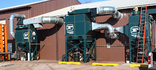 From left to right, seen outside the Fast trio of adjoining buildings: a Farr Gold Series GS8 dust collector installed in 2009 to tackle weld fumes; a GS16 installed in 2011 that captures laser-cutting dust and fumes; and a GS6 installed in 2012, also for laser-cutting fumes and dust.