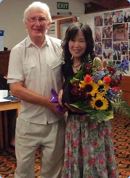 President, Gordon Sutherland, presented our guest artist from Japan, Reiko Noda, with a bouquet especially prepared by our Events Manager, Diane Lyons. Photo courtesy of Dennis Lyons.