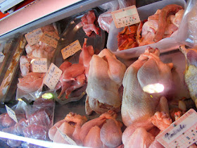 Locally produced poultry and rabbit on a market stall.  Indre et Loire, France. Photographed by Susan Walter. Tour the Loire Valley with a classic car and a private guide.