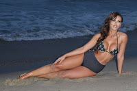 Vivian Kindle posing on a sandy beach