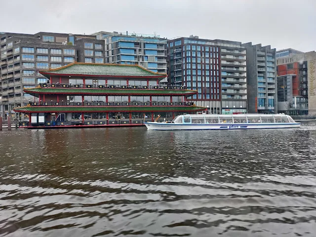 View of the Chinese Restaurant Sea Palace from the boat on the Amsterdam Canals
