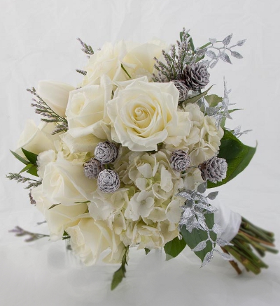 Rebecca carried this soft winter white bouquet Created with eskimo roses 