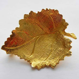 Golden leaf brooch stamped Hollywood