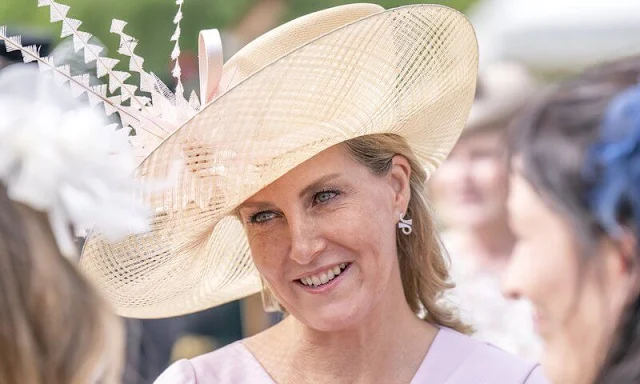 Countess of Wessex wpre a pink dress by Suzannah, Prada Natural Classic pumps, Sophie Habsburg clutch