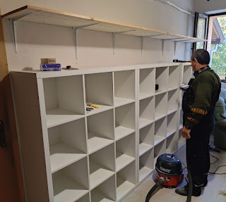 Shelves fitted and unit secured to the wall