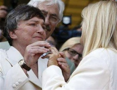 Robin Tyler places ring on Diane Olson's finger at wedding on June 16, 2008, Los Angeles, California