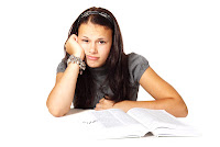 Young Woman Bored with Studying