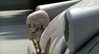 Still from the 1994 film The Little Rascals showing a close-up of the skull and crossbones mounted to the front grill of a go-cart