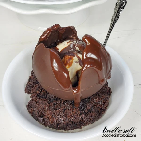 How to Make an Ice Cream Bomb!  Move over Hot Chocolate Bombs--it's time for Ice Cream Bombs!   These super rich and decadent desserts are perfect for a yummy treat any day of the week.    Loaded with chocolate, sitting on a warm brownie, filled with creamy ice cream and topped with hot fudge--these are sure to be a crowd pleaser!