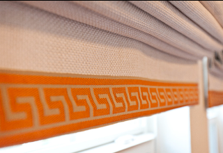 Greek key trim in orange and gold. Call The Window stylist to purchase.