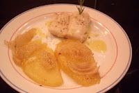 Merluza al horno con patatas y cebolla