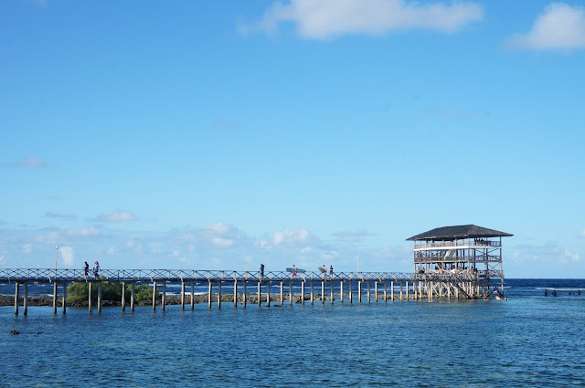 The boardwalk is a three-storey wooden structure extending a few hundred meters into the sea