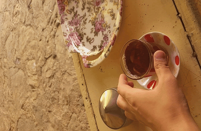 Drinking Hot black tea as Persian way