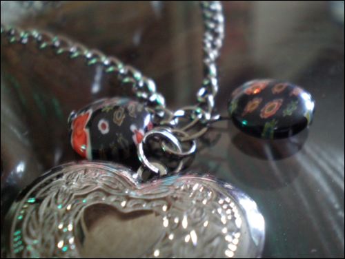 A picture (sorry, it's a little blur) of the heart locket and lampwork glass 