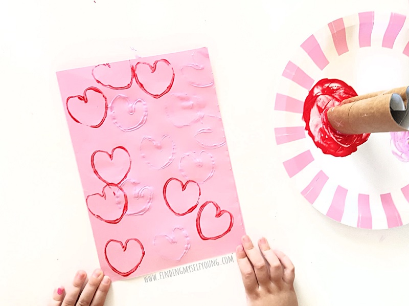 toddler heart painting with a DIY cardboard heart stamp