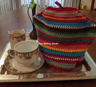 Sweet Nothings crochet free crochet pattern blog, free crochet pattern for a rainbow colored tea cozy,  photo of the tea cozy,