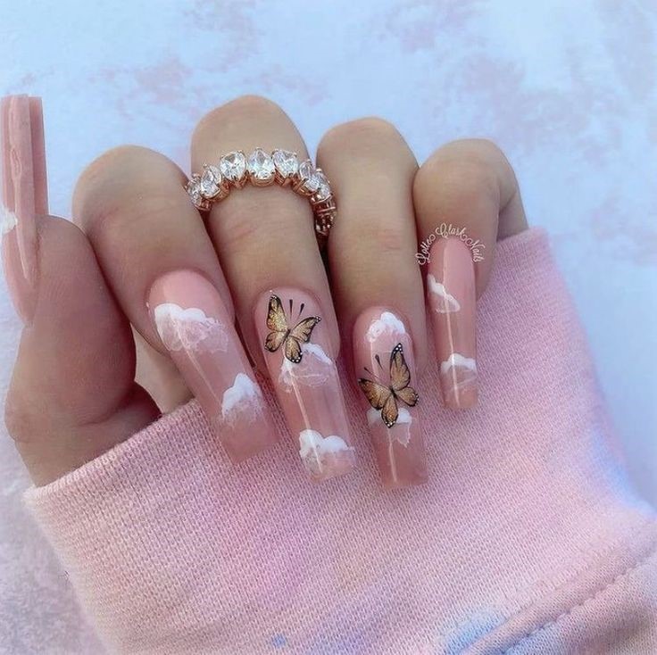pink nails with butterfly and clouds nail art