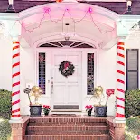 Decorated white door on Christmas Tree Lane in Alameda California