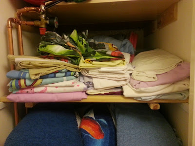 Airing cupboard shelving, made from bed slats.