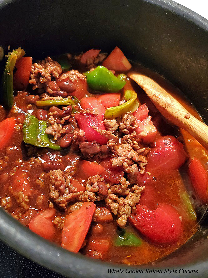 this is a pan of chili with hamburger using ground sirloin, peppers and tomatoes