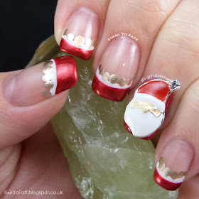 Santa Claus French Tip nail art with nail charm.