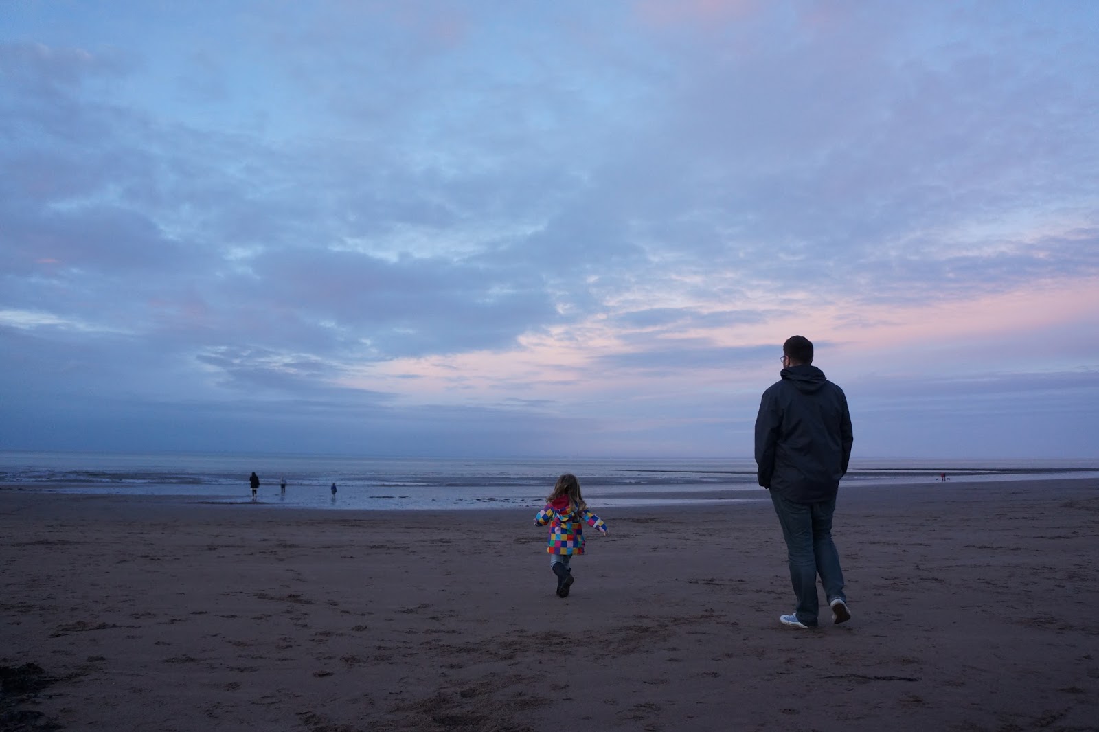 dad and daughter on a beach at butlins minehead
