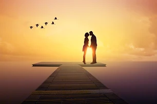 sunset and a couple kissing