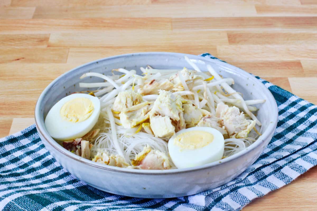 Soto Ayam (Indonesian-Style Chicken Noodle Soup) ingredients in a bowl.