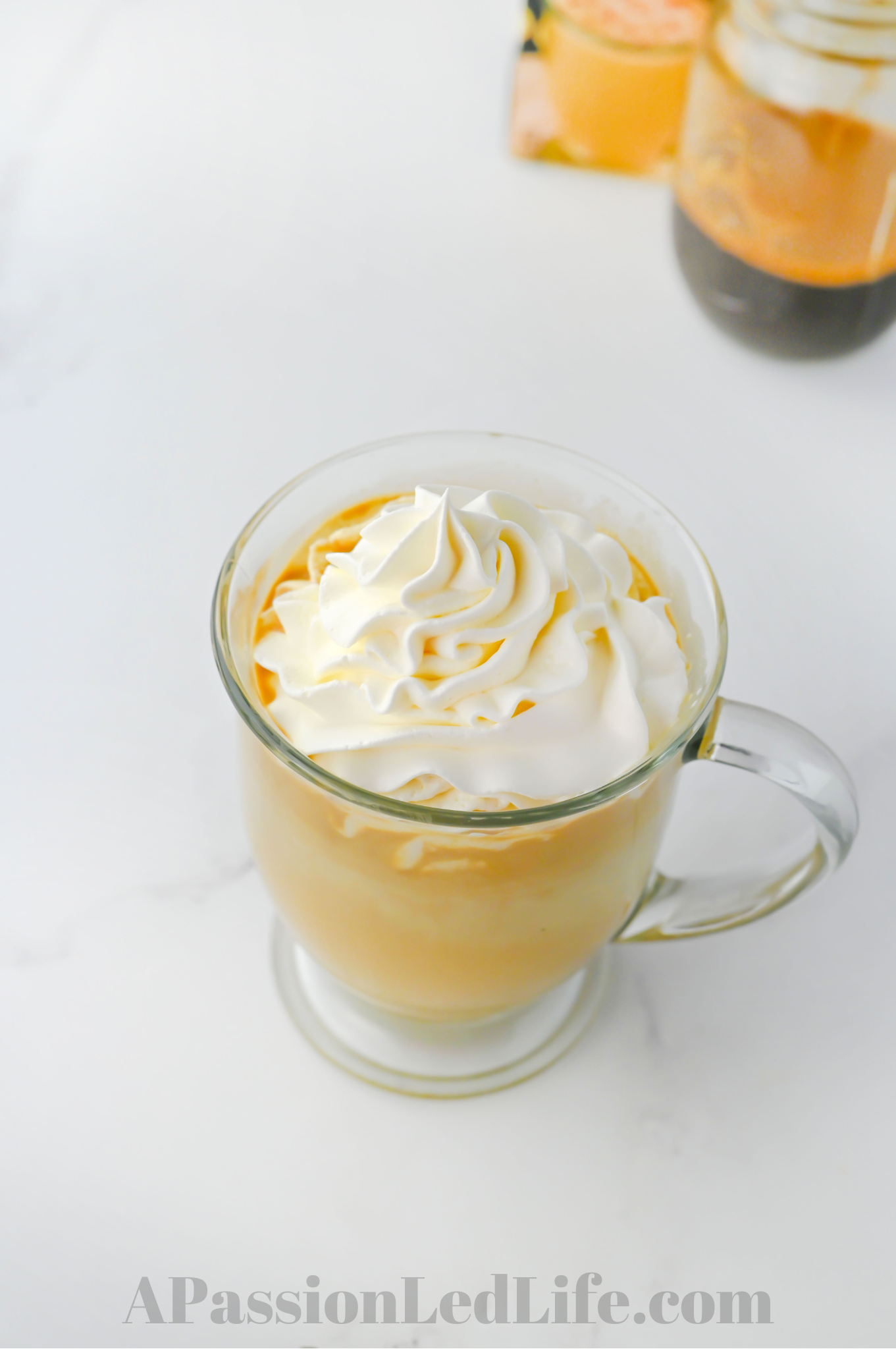 eggnog latte with whipped topping in a cup