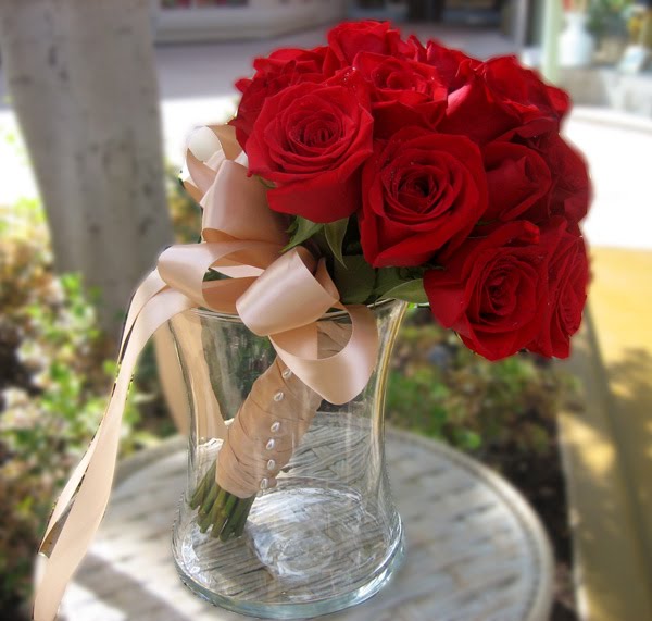 for a red rose bridal bouquet to be wrapped with flowing beige ribbon