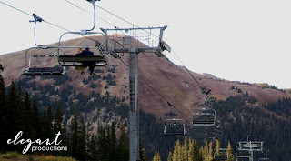 Bride groom ride chairlift in mountains at Arapahoe Basin ski area