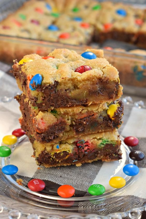 Chewy M&M's Chocolate Chip Cookie Bars are thick and delicious and perfect when you need a quick dessert. Perfect for holidays and bake sales too!