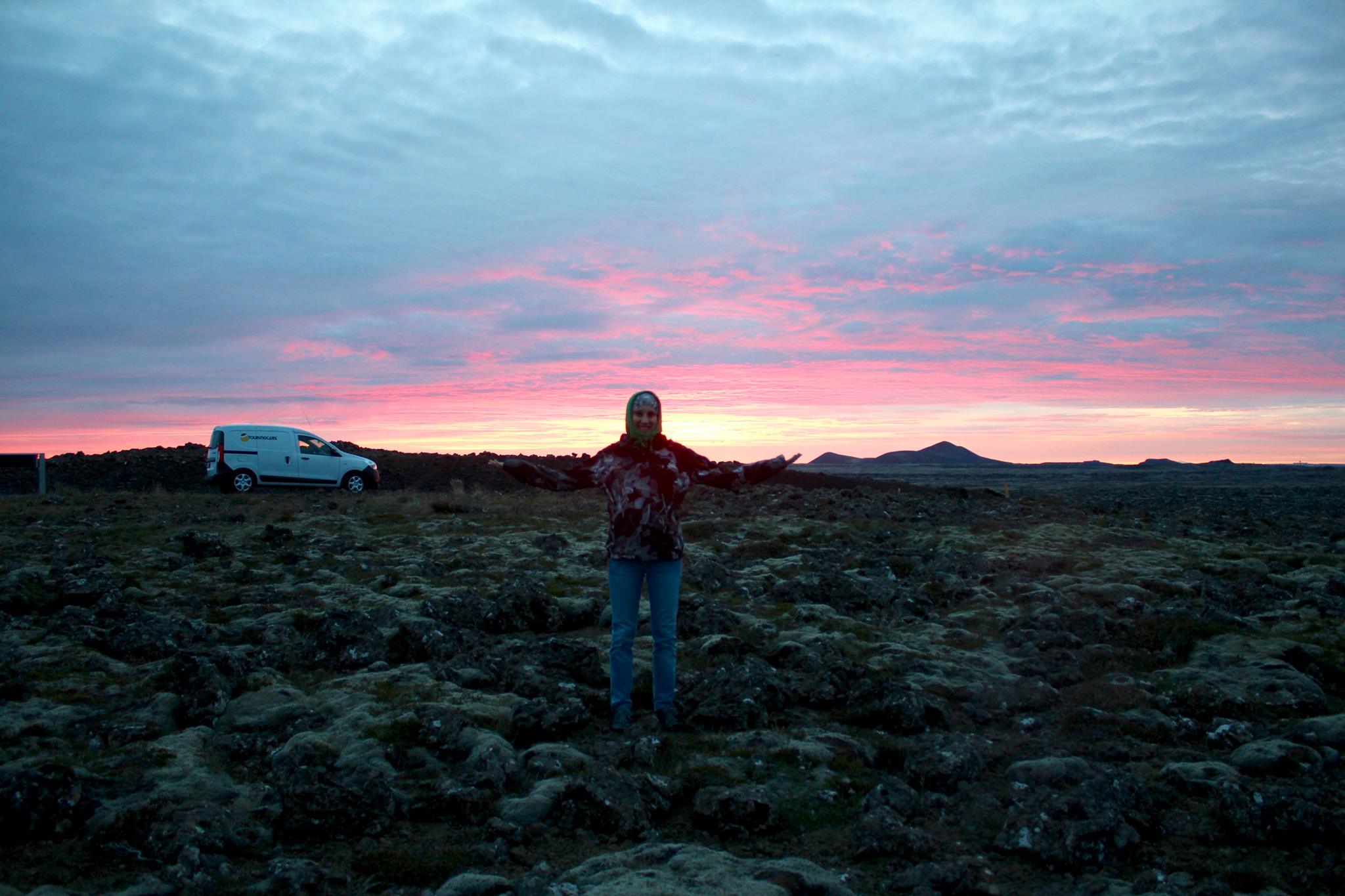 Kathi enjoying the sunrise next to the lava fields where we slept in our van for the first time